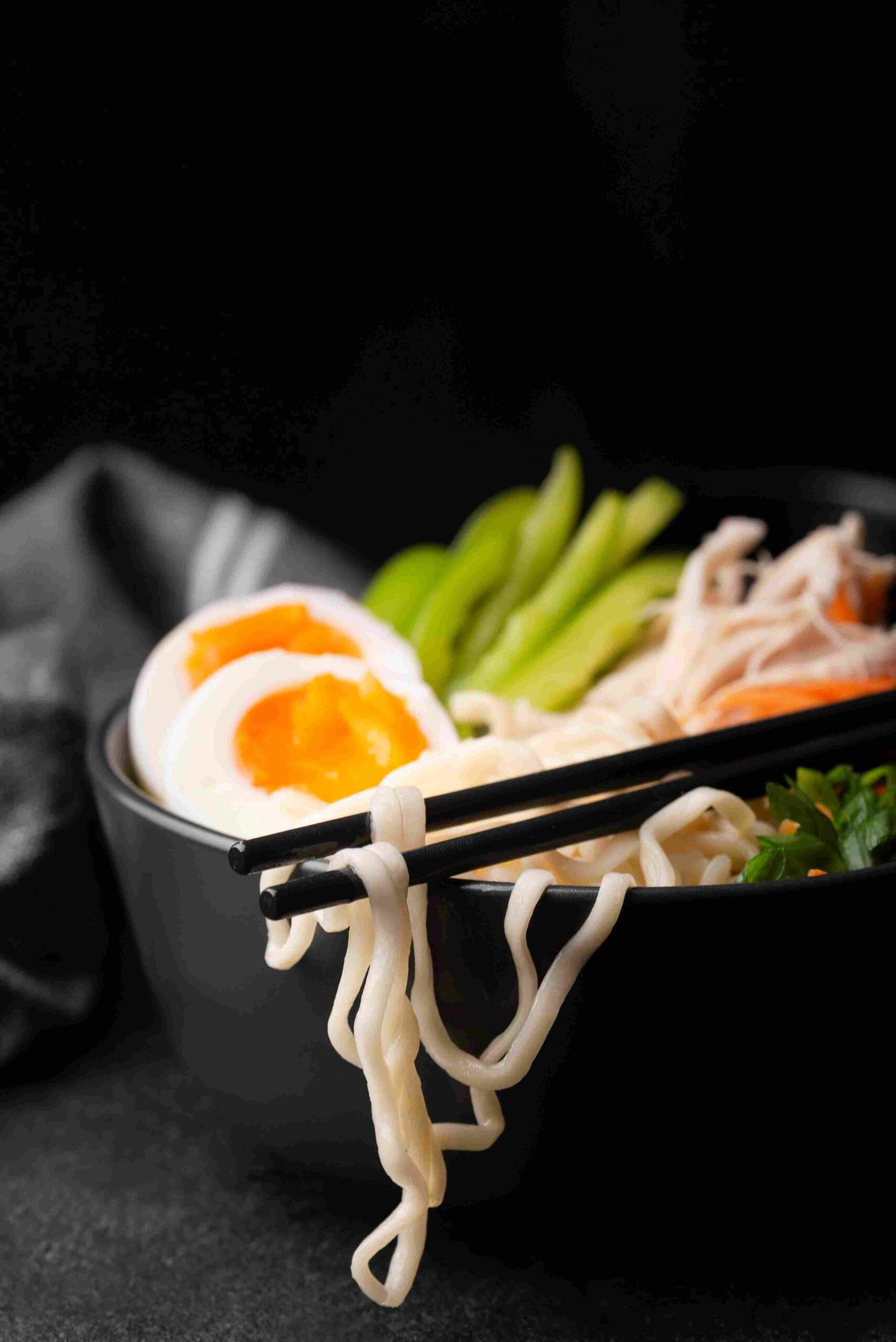 front-view-asian-noodles-with-eggs-vegetables